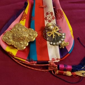 Two Gold tone brooches